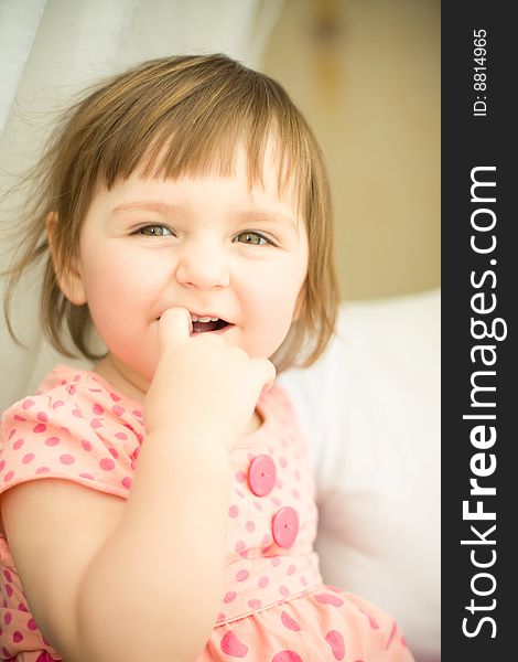 Funny girl portrait with finger in mouth. Funny girl portrait with finger in mouth