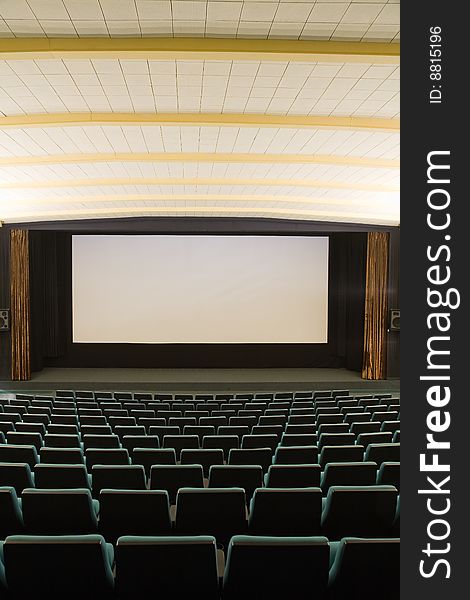 Empty cinema auditorium with line of green chairs and silver screen. Ready for adding your own picture. Empty cinema auditorium with line of green chairs and silver screen. Ready for adding your own picture.