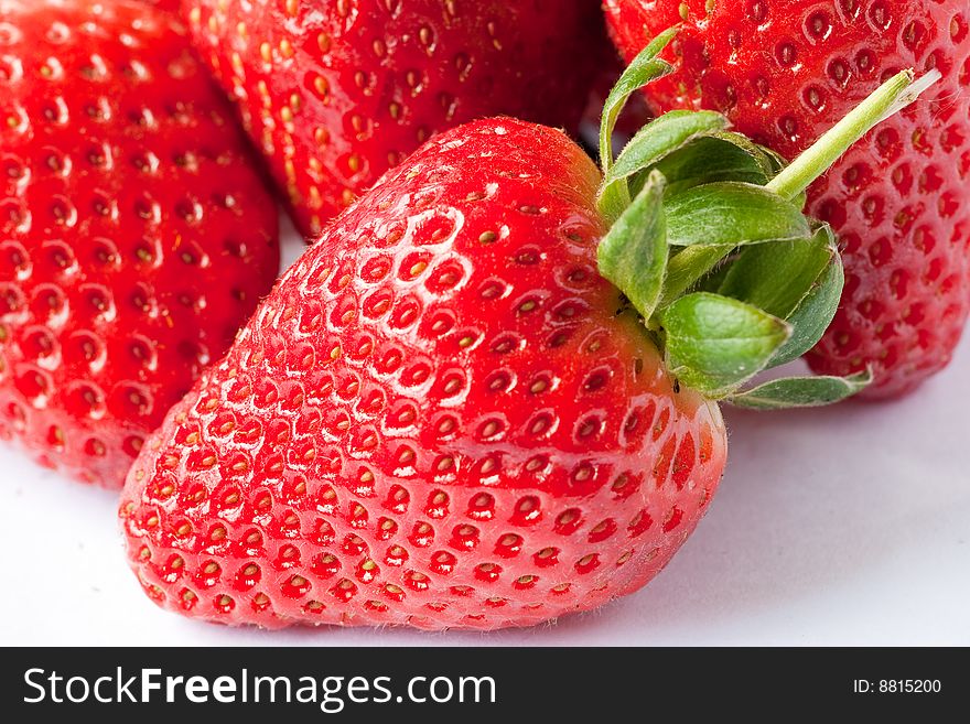 Ripe strawberries on a white background. Ripe strawberries on a white background