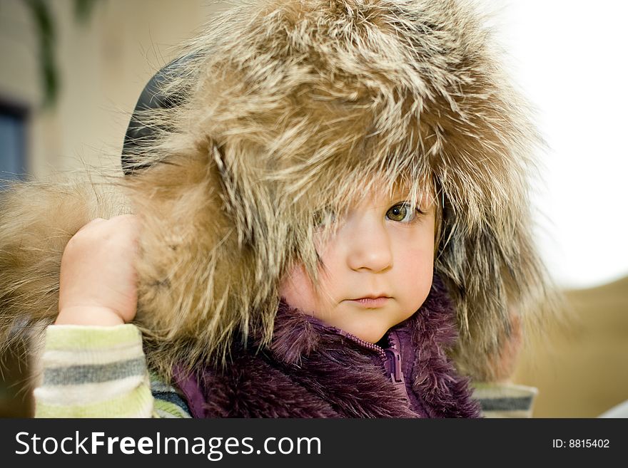 Baby in fur hat portrait. Baby in fur hat portrait