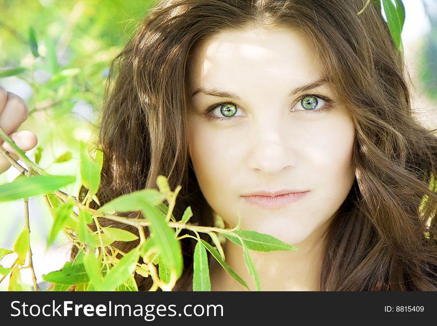 Images of smiling beautiful girl on the grass in sunny day