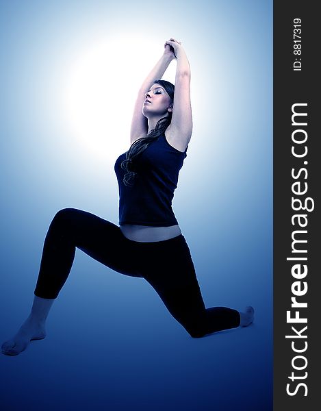 Young woman is doing an expert yoga exercise