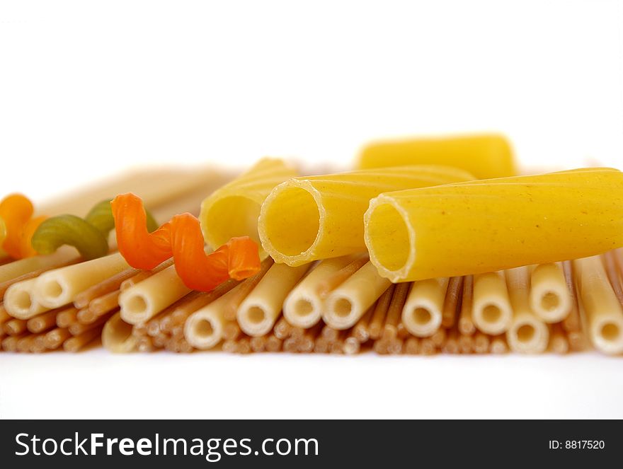 Colorful noodles frame on a white background. Soft focus. Colorful noodles frame on a white background. Soft focus