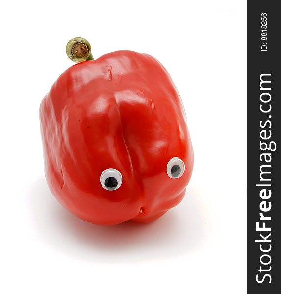 Sweet red bell pepper with eyes on white background. Sweet red bell pepper with eyes on white background