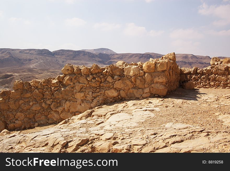 Ruined stone wall in Masada fortress, Israel. Ruined stone wall in Masada fortress, Israel