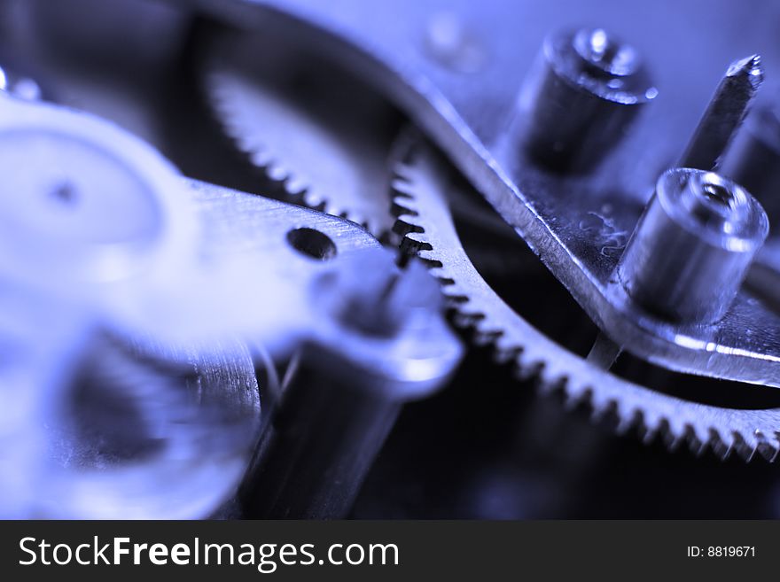 Cogs and wheels from the inside of an clock. Macro - low DOF.