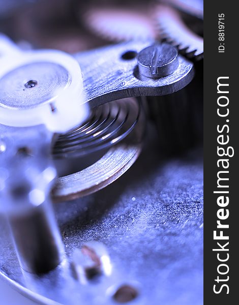 Cogs and wheels from the inside of an clock. Macro - low DOF.