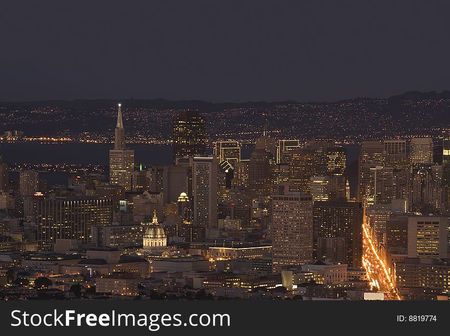 San Francisco skyline at dusk showing downtown buildings. San Francisco skyline at dusk showing downtown buildings.