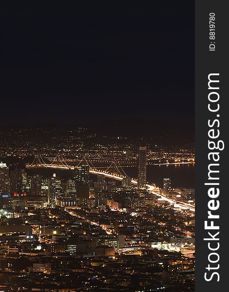 San Francisco at night with view of Baybridge.