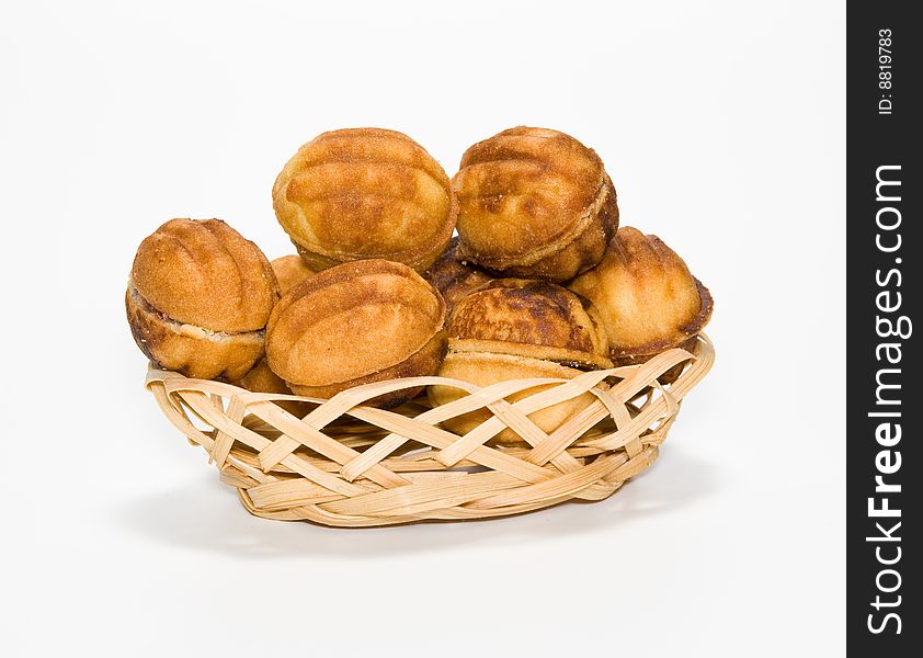 Biscuit in a small basket on a white background