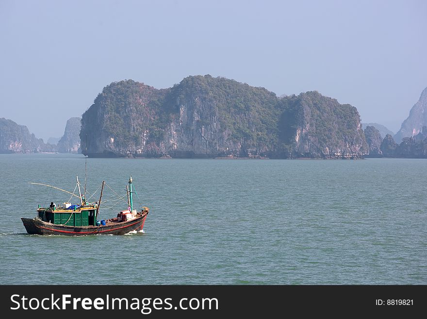 Boat and Islands in Halong Bay, Northern Vietnam