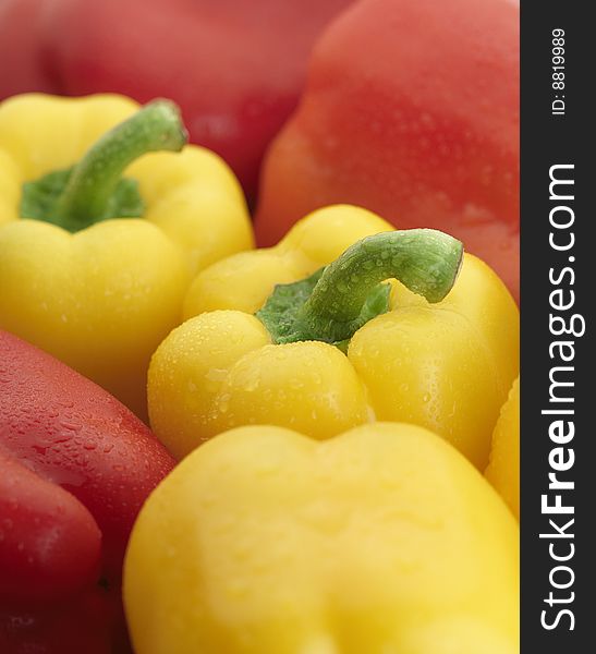 Group of Delicious Yellow and Red Bell Peppers with water drops. Group of Delicious Yellow and Red Bell Peppers with water drops.