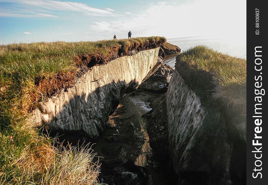 Coastal erosion reveals the extent of ice-rich permafrost underlying active layer on the Arctic Coastal Plain in the Teshekpuk Lake Special Area of the National Petroleum Reserve - Alaska. Credit: Brandt Meixell, USGS