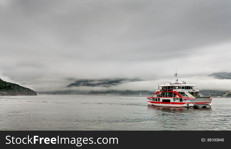 This is the ferry boat that brings visitors to Miyajima Island from Hiroshima, Japan. The rain was torrential on the day we visited but this photo was taken during a brief lull in the downpour. This is the ferry boat that brings visitors to Miyajima Island from Hiroshima, Japan. The rain was torrential on the day we visited but this photo was taken during a brief lull in the downpour.