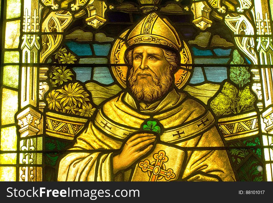 Detail of St Patrick with a shamrock in a stained glass window at the Smith Museum of Stained Glass Windows at Navy Pier in Chicago.