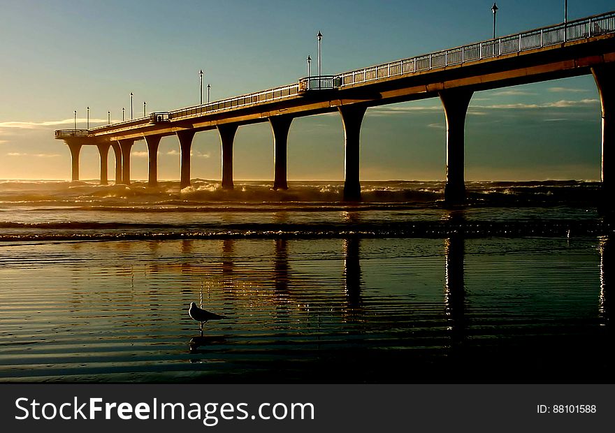 The suburb is divided into three sections spread along the southern coast of Pegasus Bay: North New Brighton; New Brighton; and South New Brighton, which lies at the northern end of a narrow peninsula between the bay and the Avon Heathcote Estuary. A 300 metres &#x28;980 ft&#x29; pier was built here in the 1990s, and opened on November 1997. New Brighton was originally a distinct coastal village, separated from the then outer suburbs of Christchurch by the swampy areas adjoining the Avon River. However, urban expansion, land reclamation and drainage have led to Brighton being swallowed by Christchurch city. The suburb is divided into three sections spread along the southern coast of Pegasus Bay: North New Brighton; New Brighton; and South New Brighton, which lies at the northern end of a narrow peninsula between the bay and the Avon Heathcote Estuary. A 300 metres &#x28;980 ft&#x29; pier was built here in the 1990s, and opened on November 1997. New Brighton was originally a distinct coastal village, separated from the then outer suburbs of Christchurch by the swampy areas adjoining the Avon River. However, urban expansion, land reclamation and drainage have led to Brighton being swallowed by Christchurch city.