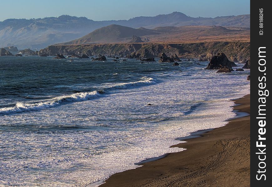 Ocean Waves On A Sandy Beach