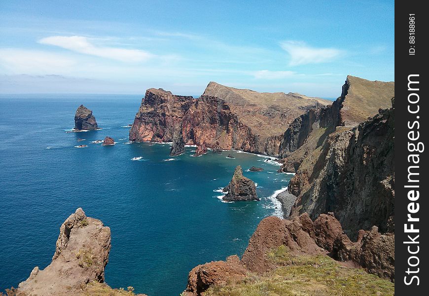 Volcanic Rock Formations Overlooking An Ocean