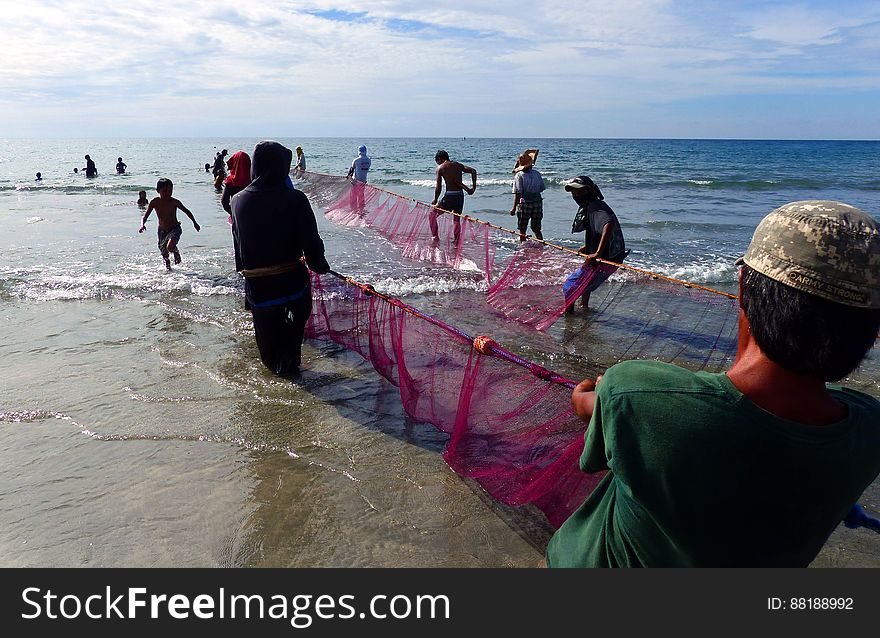 Hauling In The Nets. Philippines.