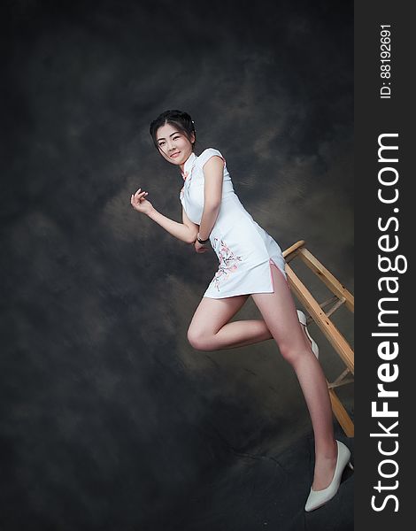 Asian Woman In Short White Dress