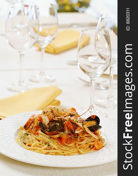 Pasta with seafood on white plate