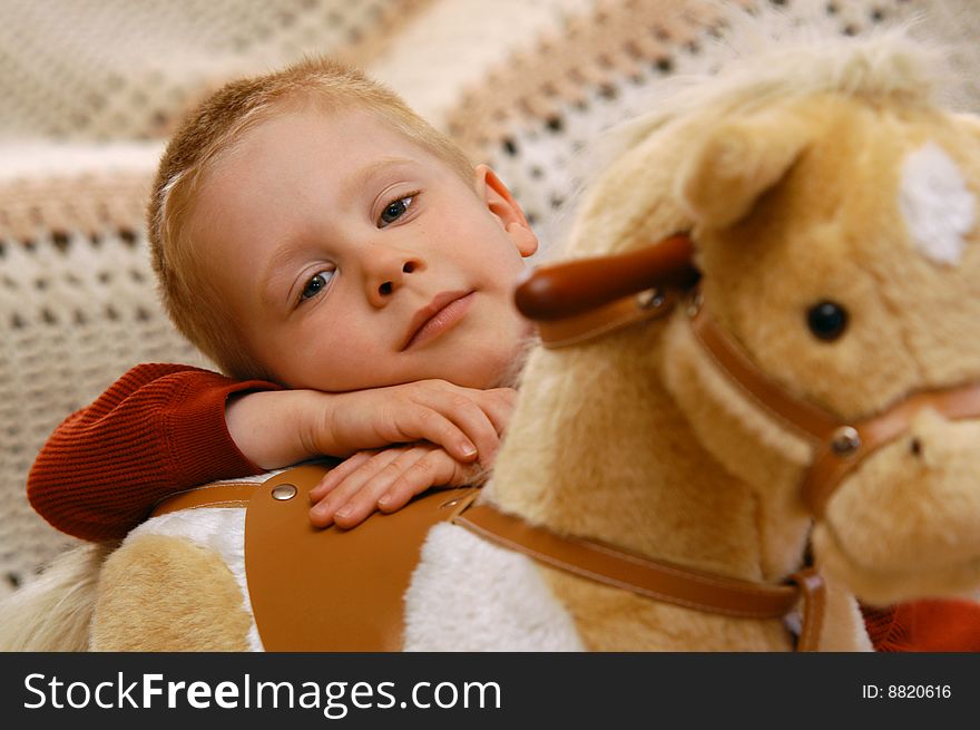 Boy With Toy Horse