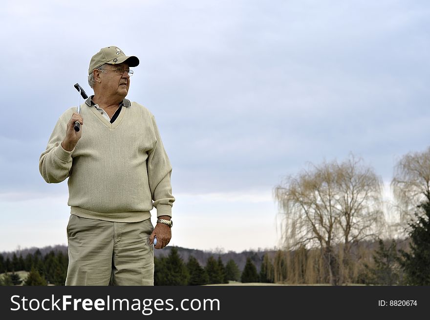 Senior male on golf course. Senior male on golf course