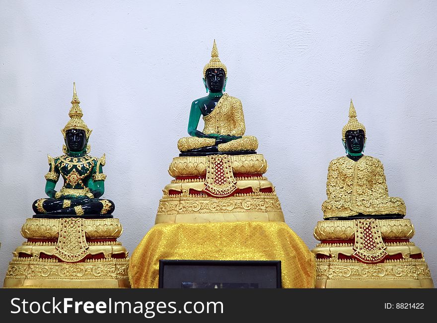 Statue of buddha over a white background.