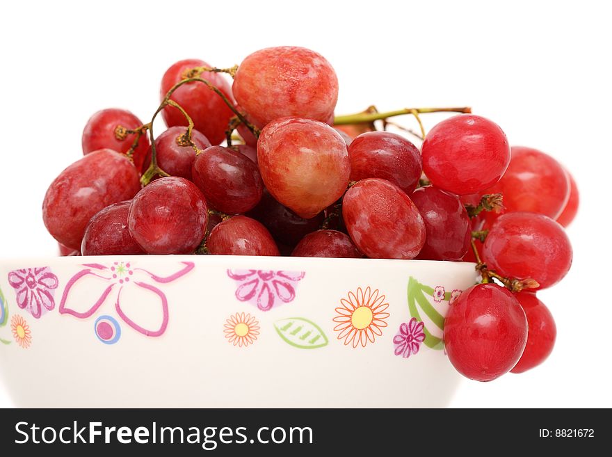 Close up of grapes in bowl over white background. Close up of grapes in bowl over white background.