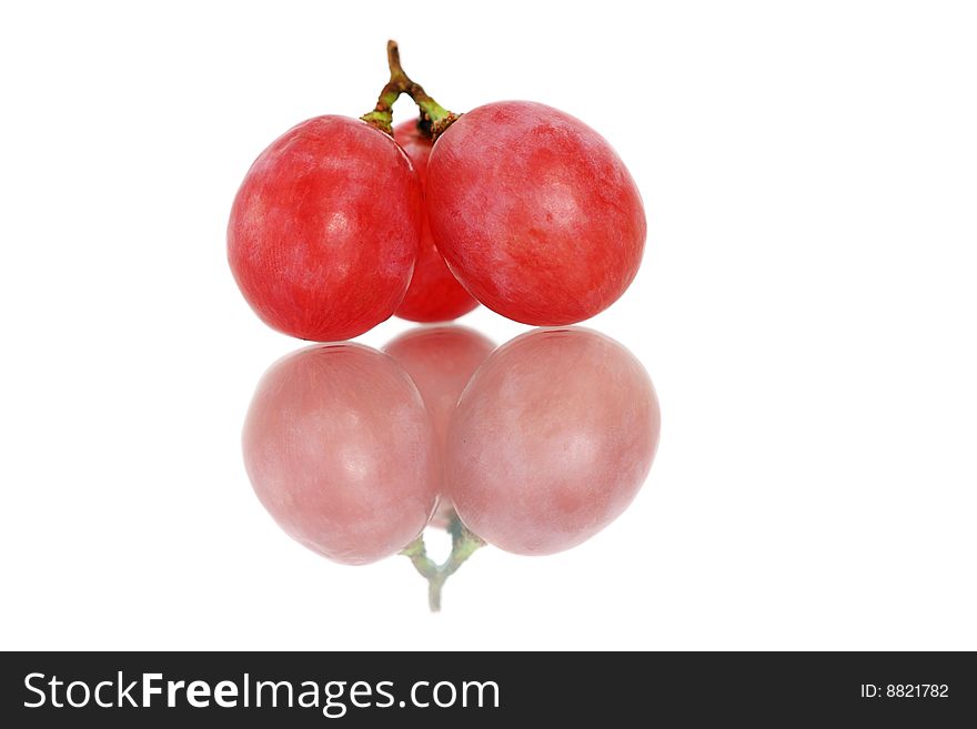 A string of three grapes isolated on white background. A string of three grapes isolated on white background.