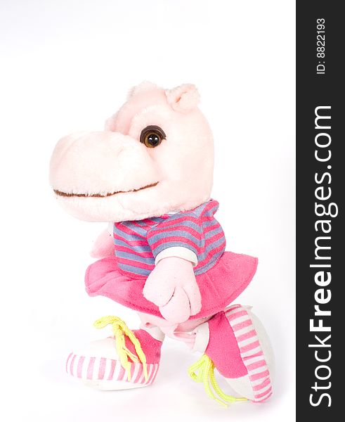 Toy hippopotamus rose colour on white background