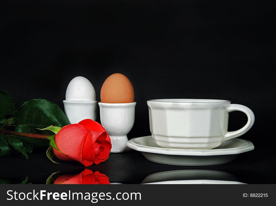 Single rose with a morning coffee and eggs. Single rose with a morning coffee and eggs.