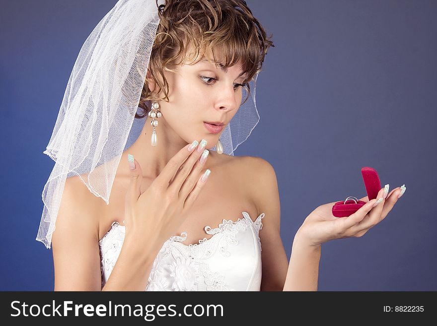 Studio portrait of a young bride with wedding rings