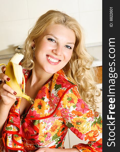 Pretty girl eating a banana