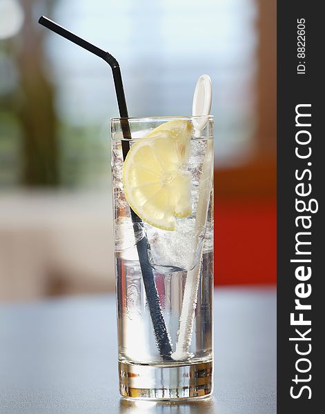 Fresh tasty cocktail with ice and lemon