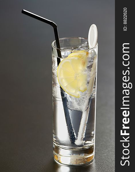 Fresh tasty cocktail with ice and lemon