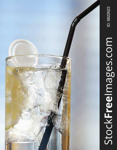 Fresh tasty cocktail with ice and lemon