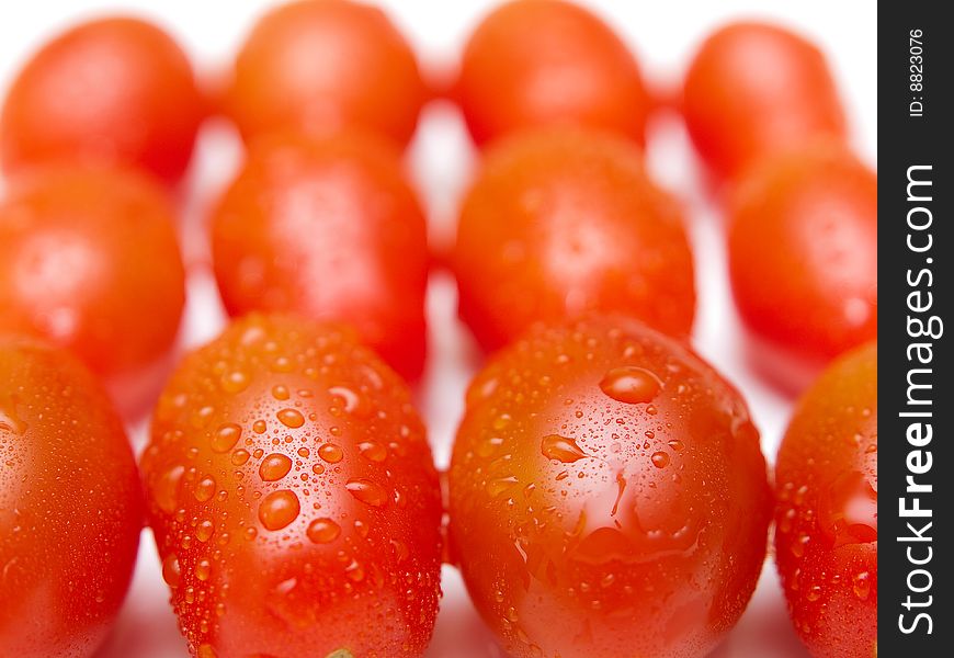 Red tomatoes close-up with drops. Red tomatoes close-up with drops.