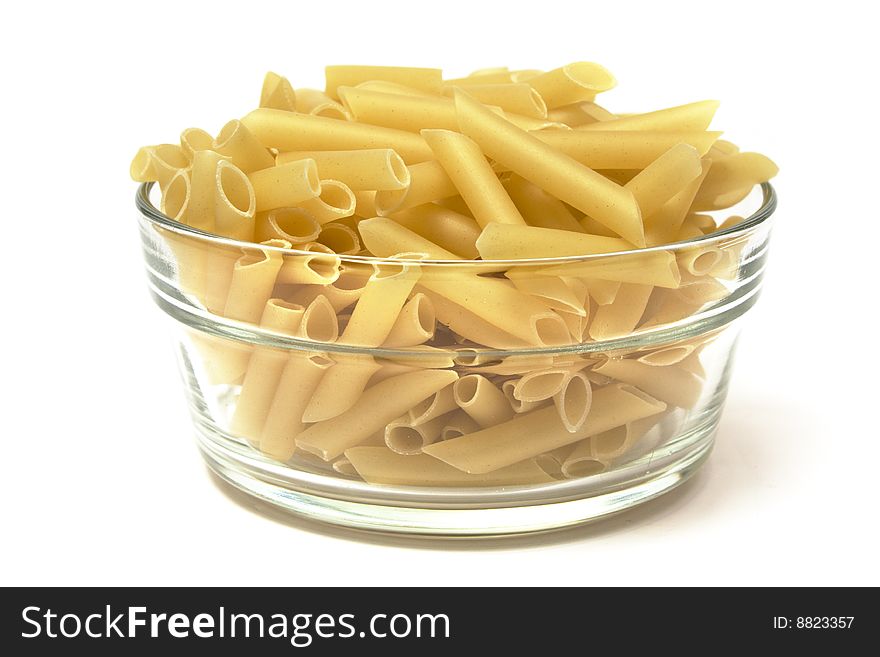 Macaroni penne in glass container isolated on white. Macaroni penne in glass container isolated on white