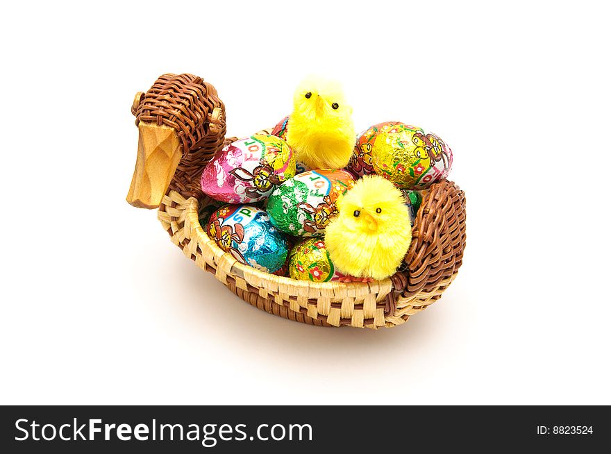 Easter basket with chocolate eggs and chicken