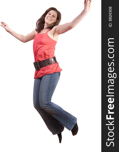 Young woman jumping in the air. Slight motion bluriness is intended. Young woman jumping in the air. Slight motion bluriness is intended.