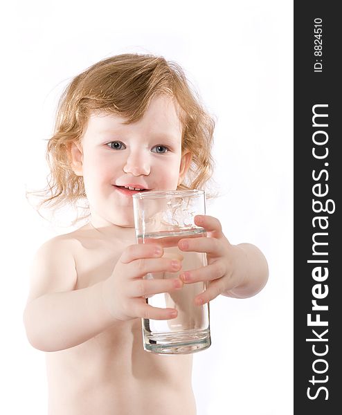 Cute little girl with a glass of clear water