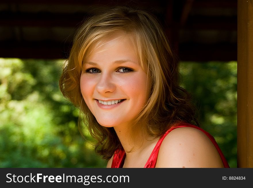 Closeup portrait of a beautiful smiling young woman