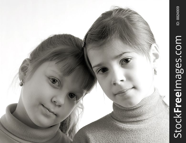 An image of a portrait of two nice little girls. An image of a portrait of two nice little girls