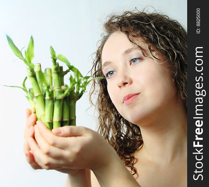 Stock photo: an image of a beautiful woman with bamboo
