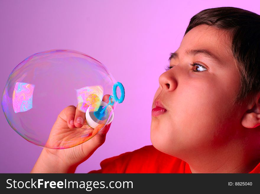 Boy Blowing Soap Bubbles