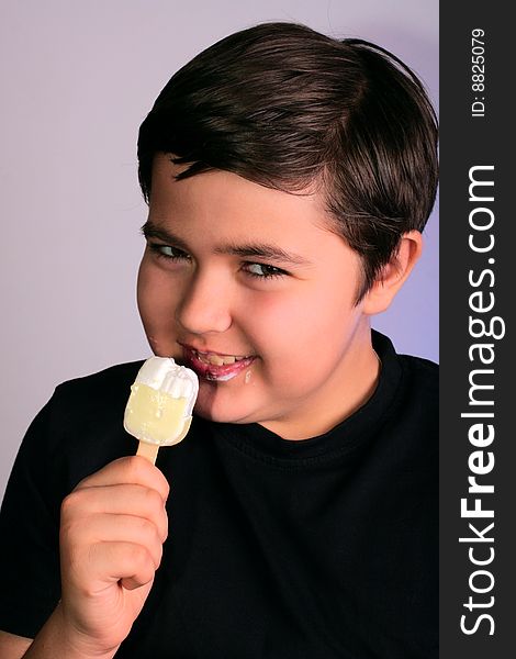 Little boy eats tasty ice-cream