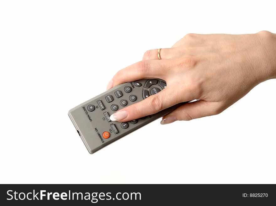 Female hand holding a remote on white