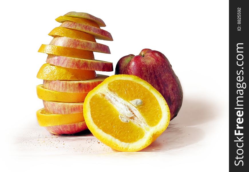 The fruit set of apples and oranges on a white background. The fruit set of apples and oranges on a white background