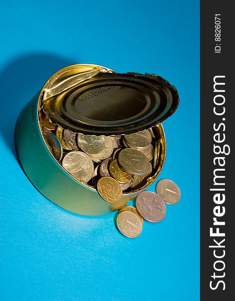 Tin with coins